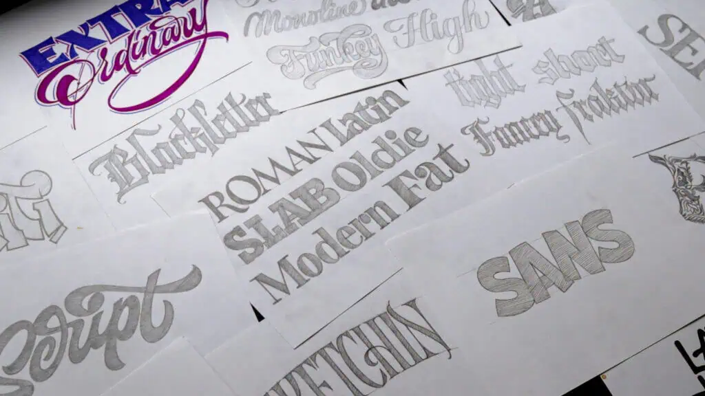 Variety of unique typography sketches on paper.