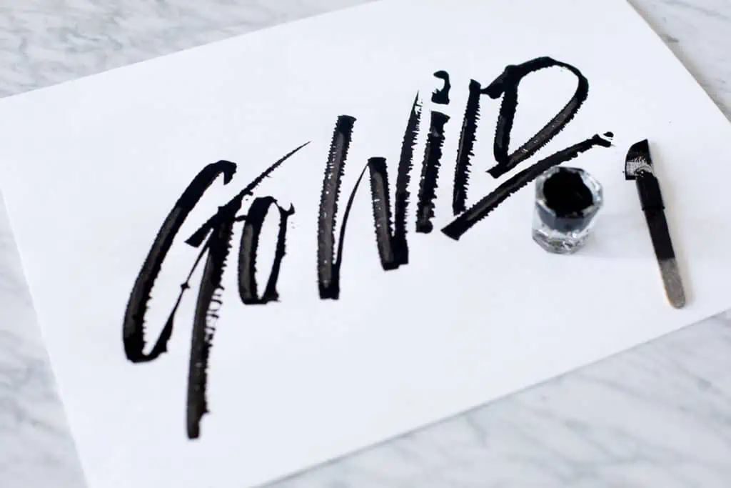 Bold calligraphy artwork saying 'Go Wild'.