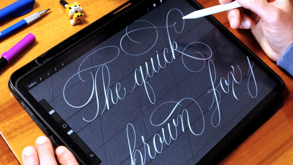 Person practicing calligraphy on a tablet