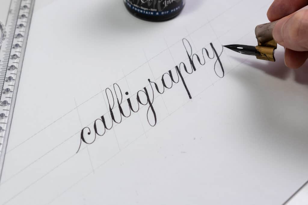 Calligraphy done with a traditional dip pen and pointed nib.