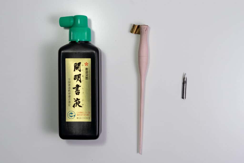 DYI calligraphy set containing ink, holder, and nib.