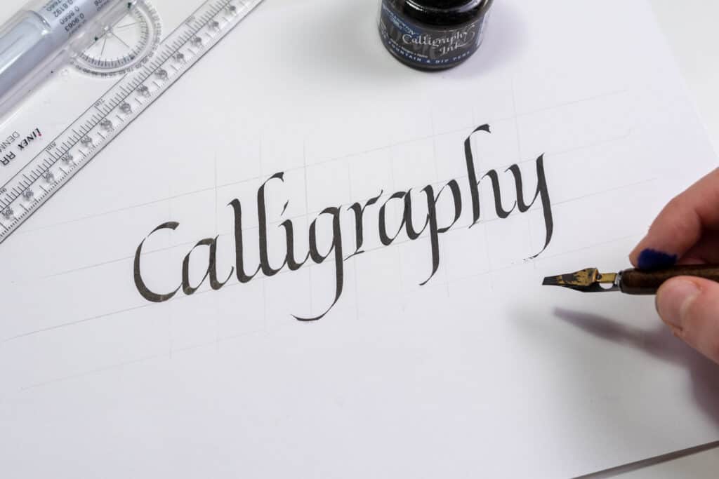 Italic calligraphy written with a Speedball broad-edged nib and sumi ink. 