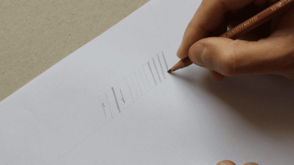 Practicing the fundamental strokes for pencil calligraphy. 