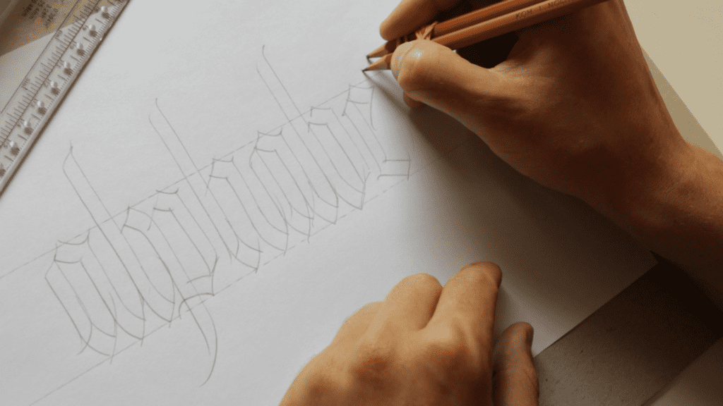 Blackletter calligraphy with a pencil. 
