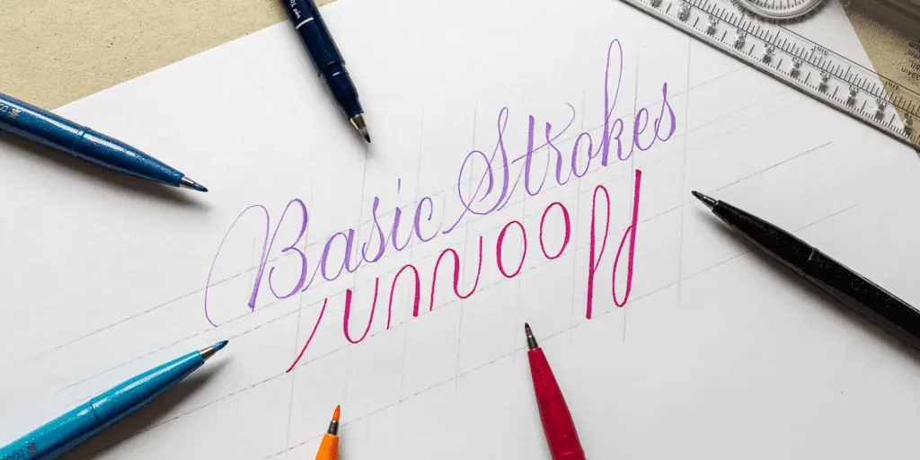 Colorful lettering demonstration with pens on paper.