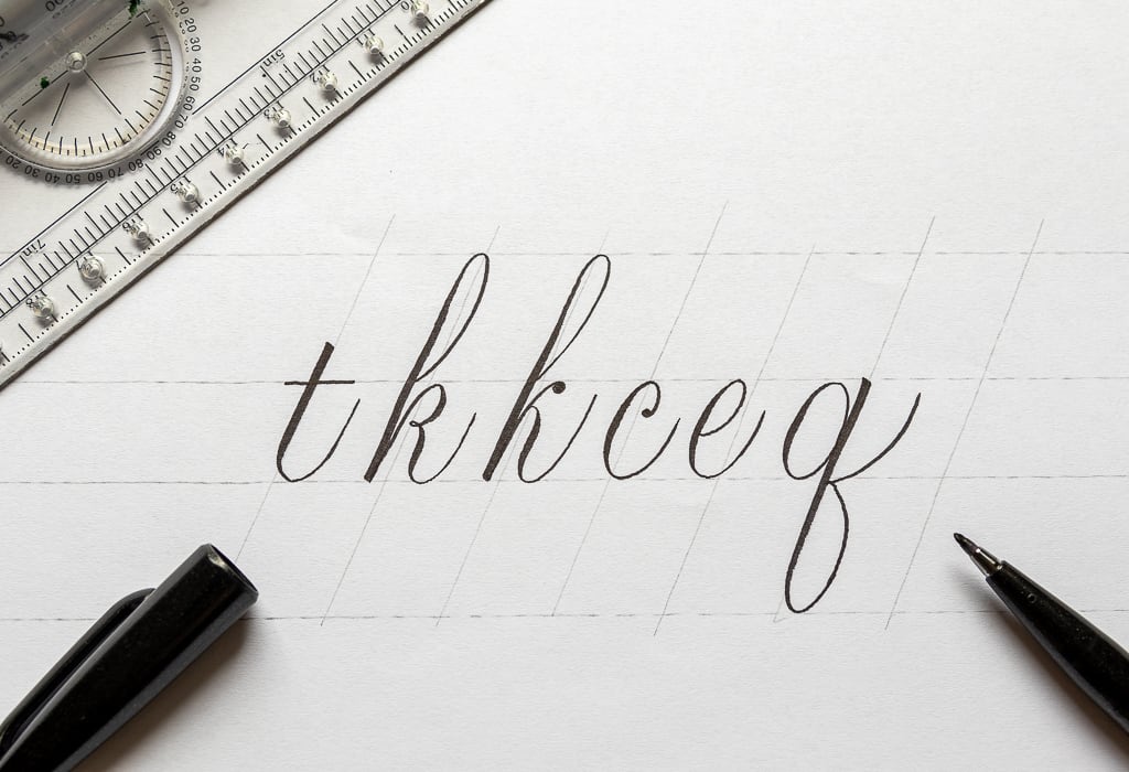 Calligraphy letters with slight additions to the basic strokes.