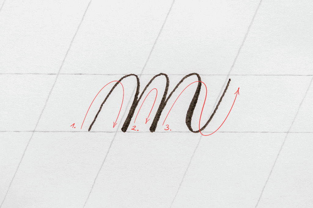 The letter m in calligraphy. 