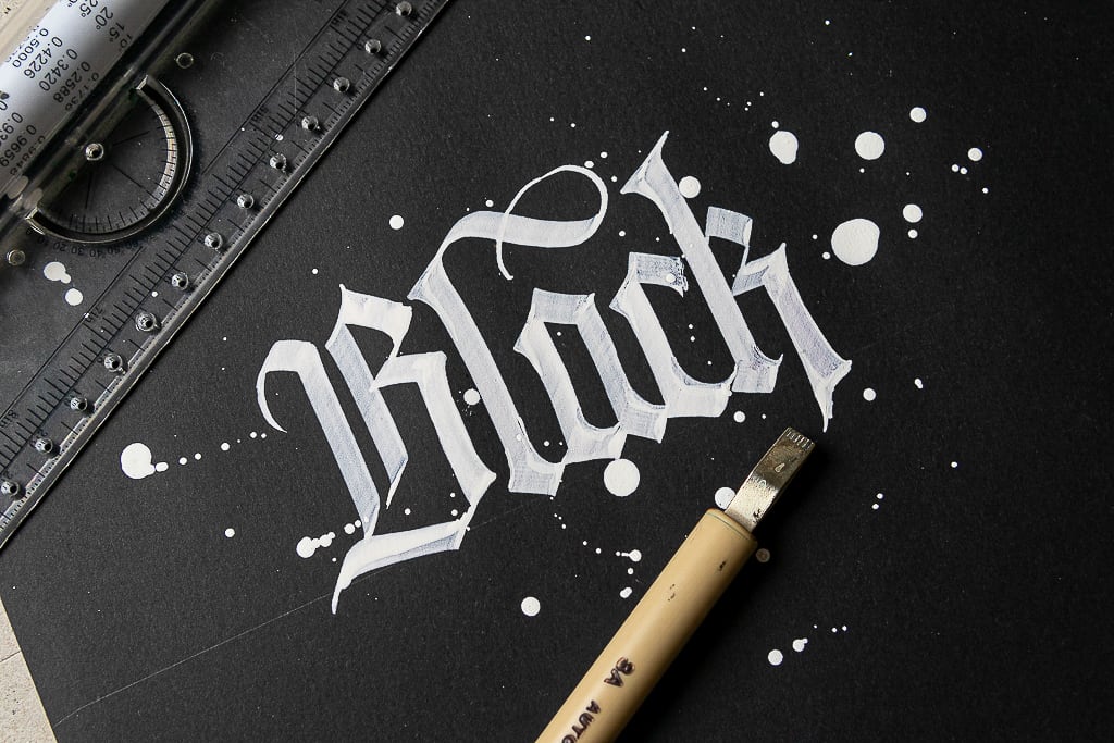 White calligraphy on black paper. 
