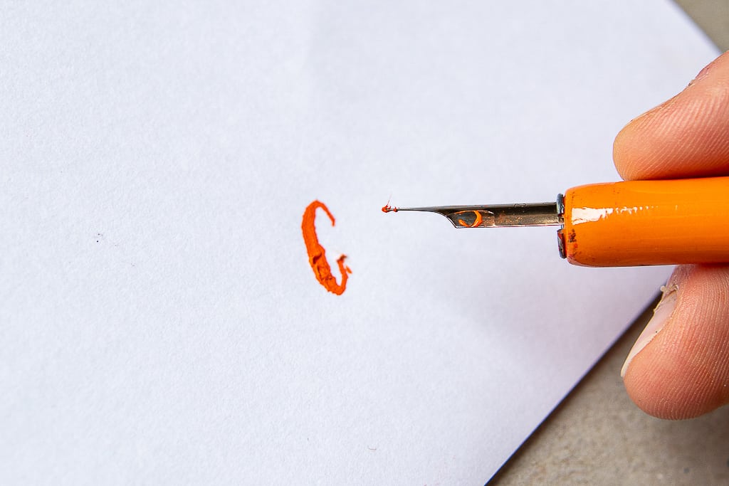 example of calligraphy nib catching onto the paper fibers. 