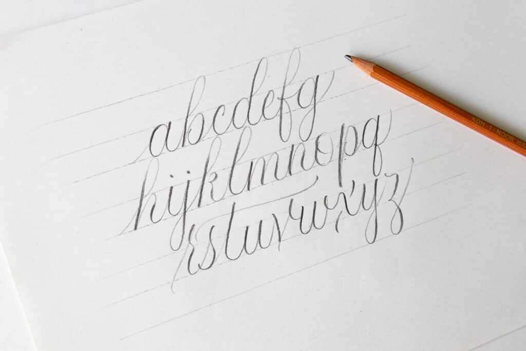 Handwritten alphabet in cursive style