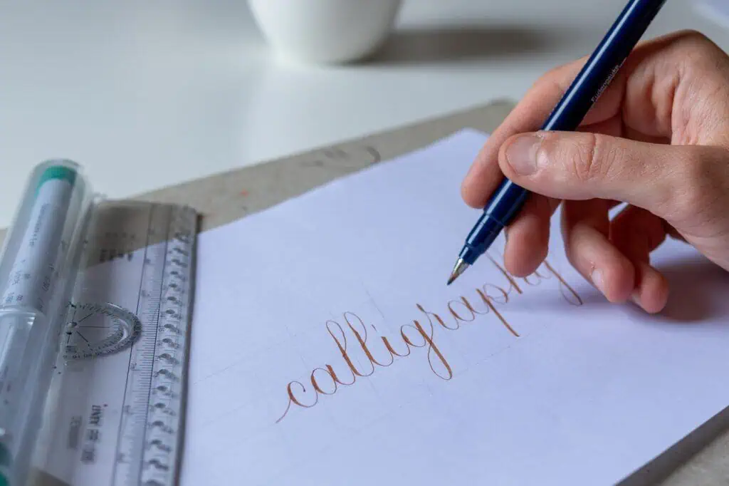 Handwriting 'calligraphy' with a blue pen.