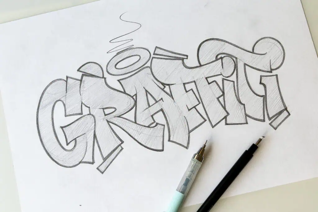 Pencil sketch of the word 'graffiti'.