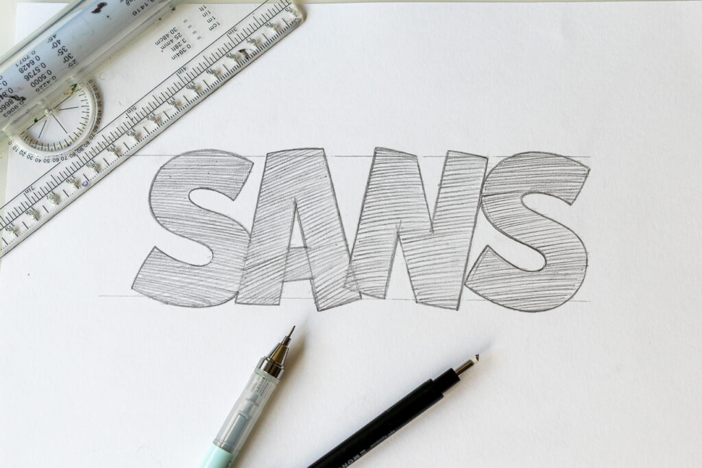 Pencil sketch of the word 'SANS'.
