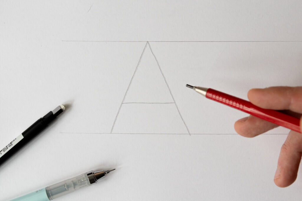 Drawing the letter A with drafting tools