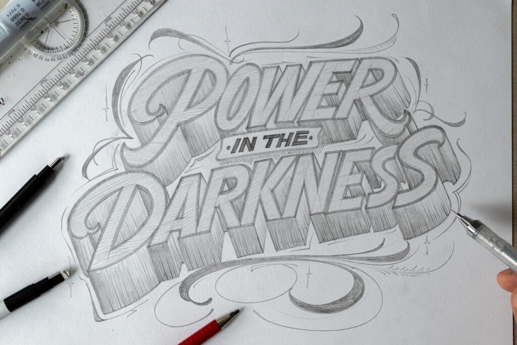 Pencil sketch of 'Power in the Darkness' text.